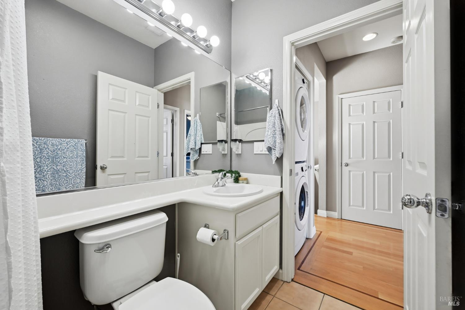 2983 Bay Village Avenue Santa Rosa, CA 95403 - Photo 28 of 35 a bathroom with a sink a toilet a mirror and shower