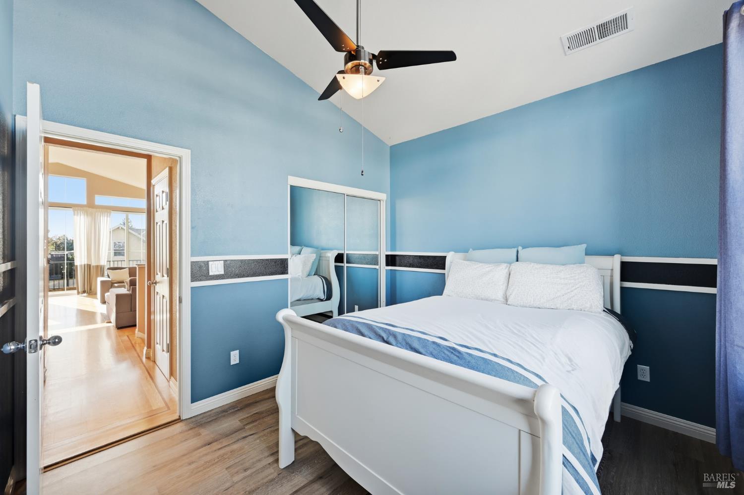 2983 Bay Village Avenue Santa Rosa, CA 95403 - Photo 30 of 35 a room with a bed and a ceiling fan