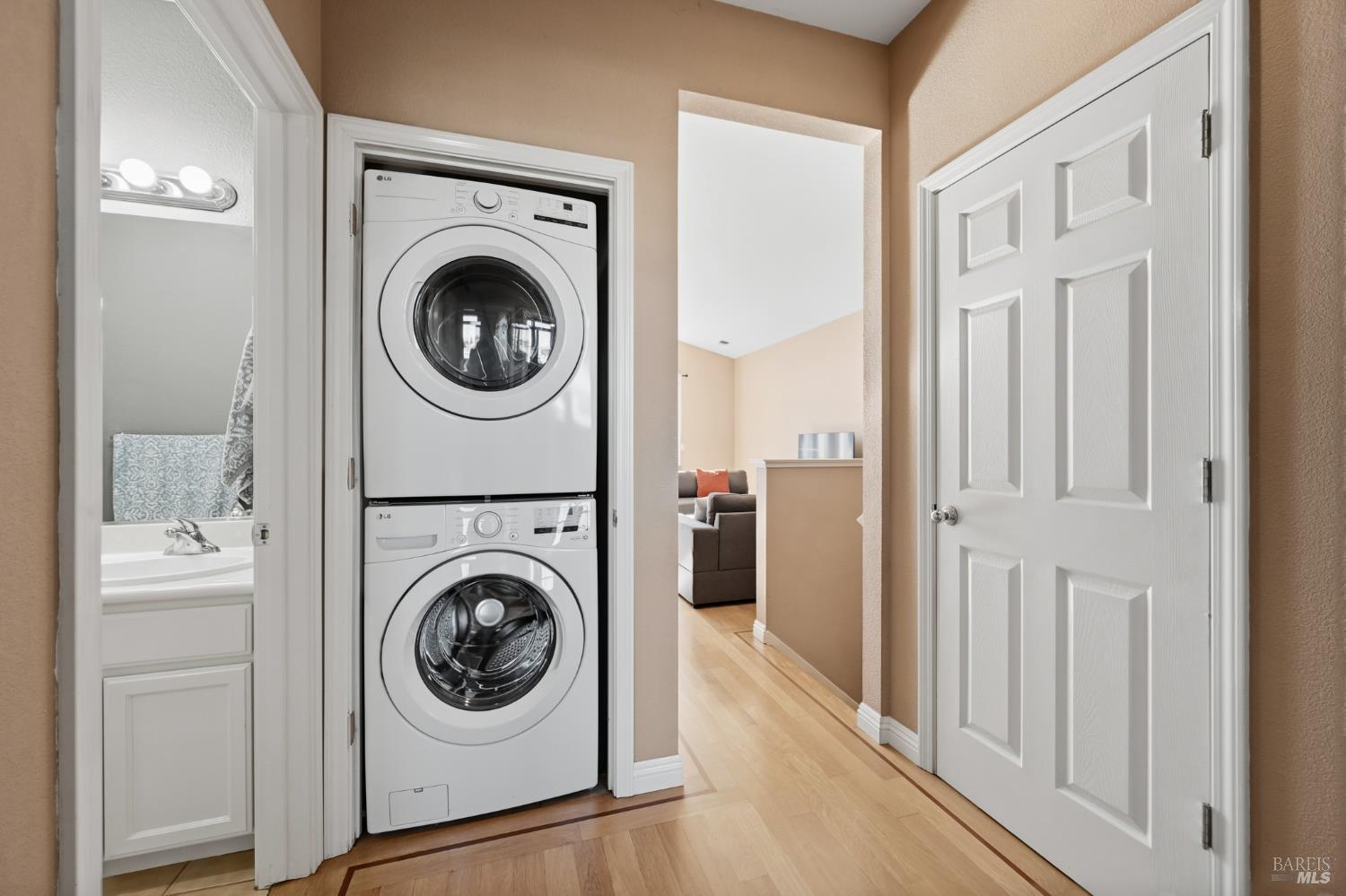 2983 Bay Village Avenue Santa Rosa, CA 95403 - Photo 32 of 35 a view of a hallway with washer and dryer