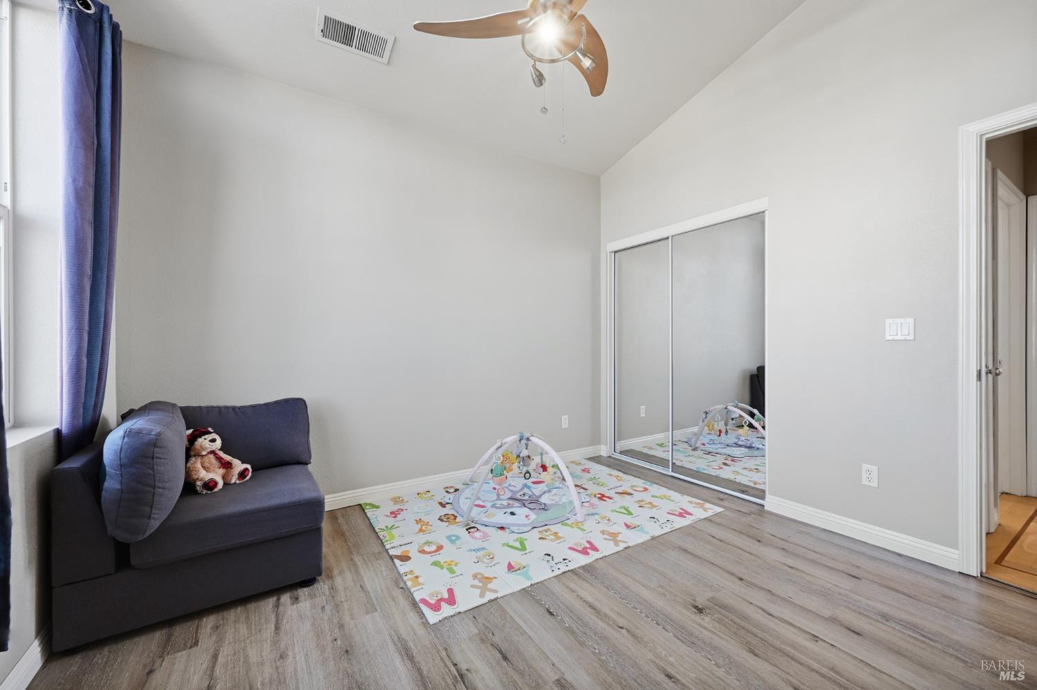 2983 Bay Village Avenue Santa Rosa, CA 95403 - Photo 34 of 35 a bedroom with bed and wooden floor