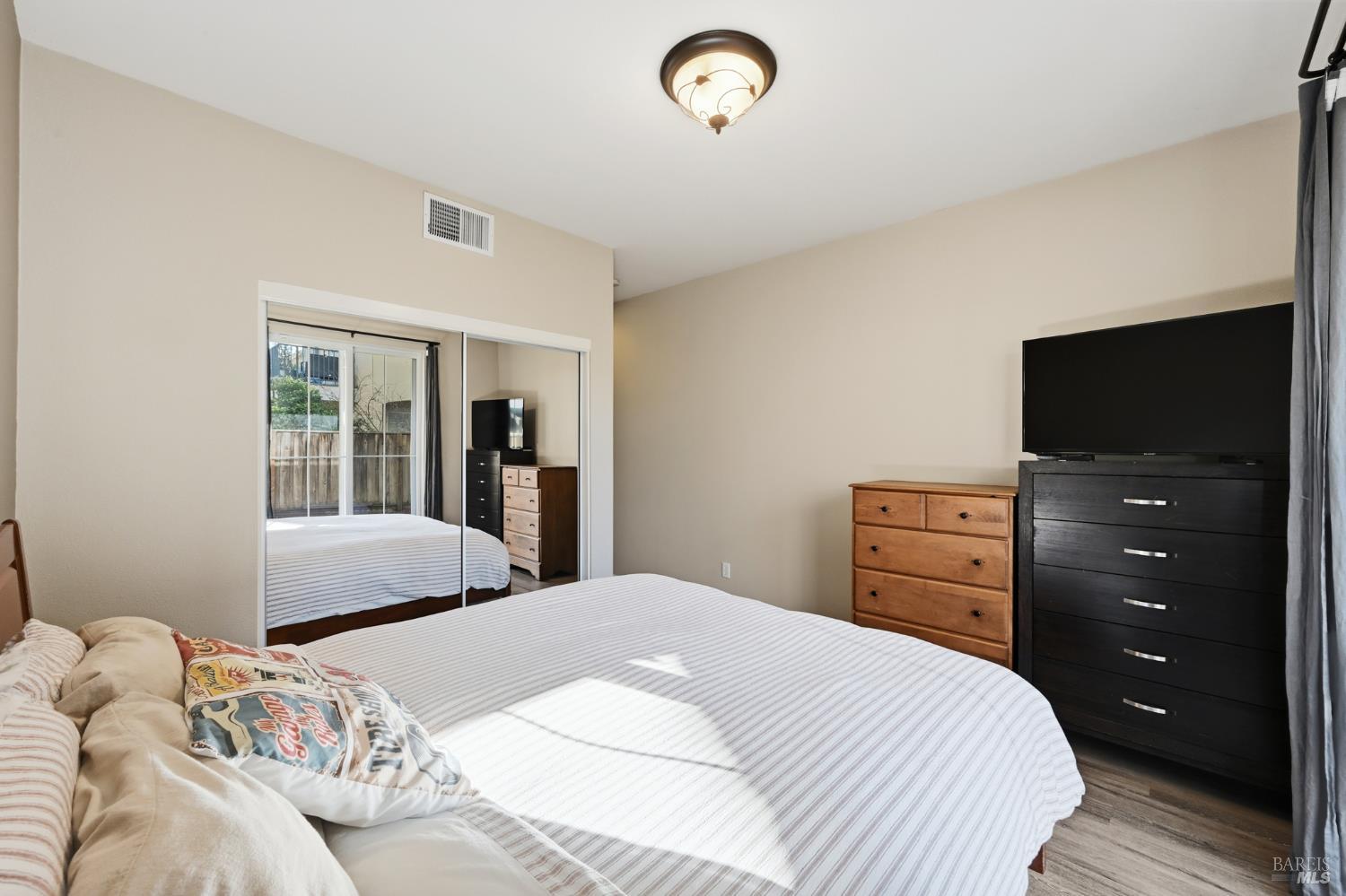 2983 Bay Village Avenue Santa Rosa, CA 95403 - Photo 5 of 35 a bedroom with a bed and a flat screen tv