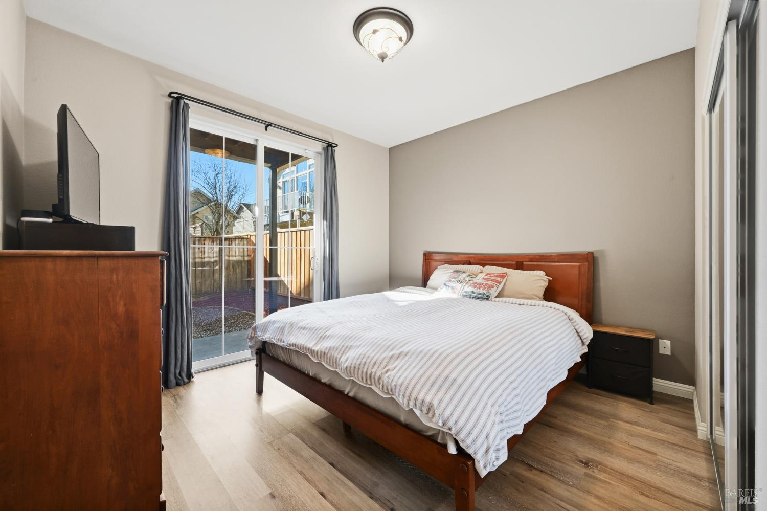 2983 Bay Village Avenue Santa Rosa, CA 95403 - Photo 6 of 35 a bedroom with a bed and a flat screen tv