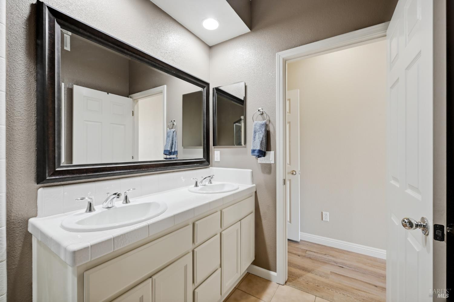 2983 Bay Village Avenue Santa Rosa, CA 95403 - Photo 7 of 35 a bathroom with a sink and a mirror
