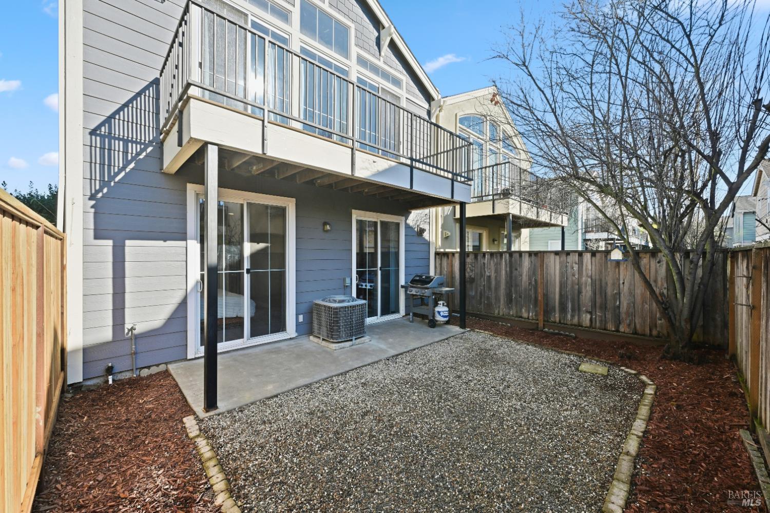 2983 Bay Village Avenue Santa Rosa, CA 95403 - Photo 10 of 35 a view of a house with a wooden fence