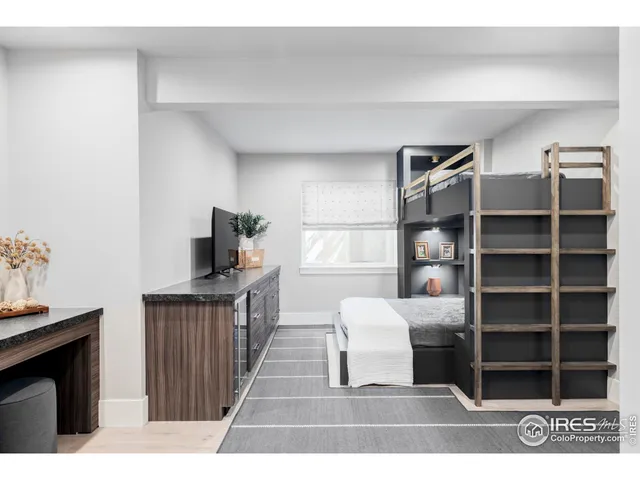a living room with furniture window and a flat screen tv
