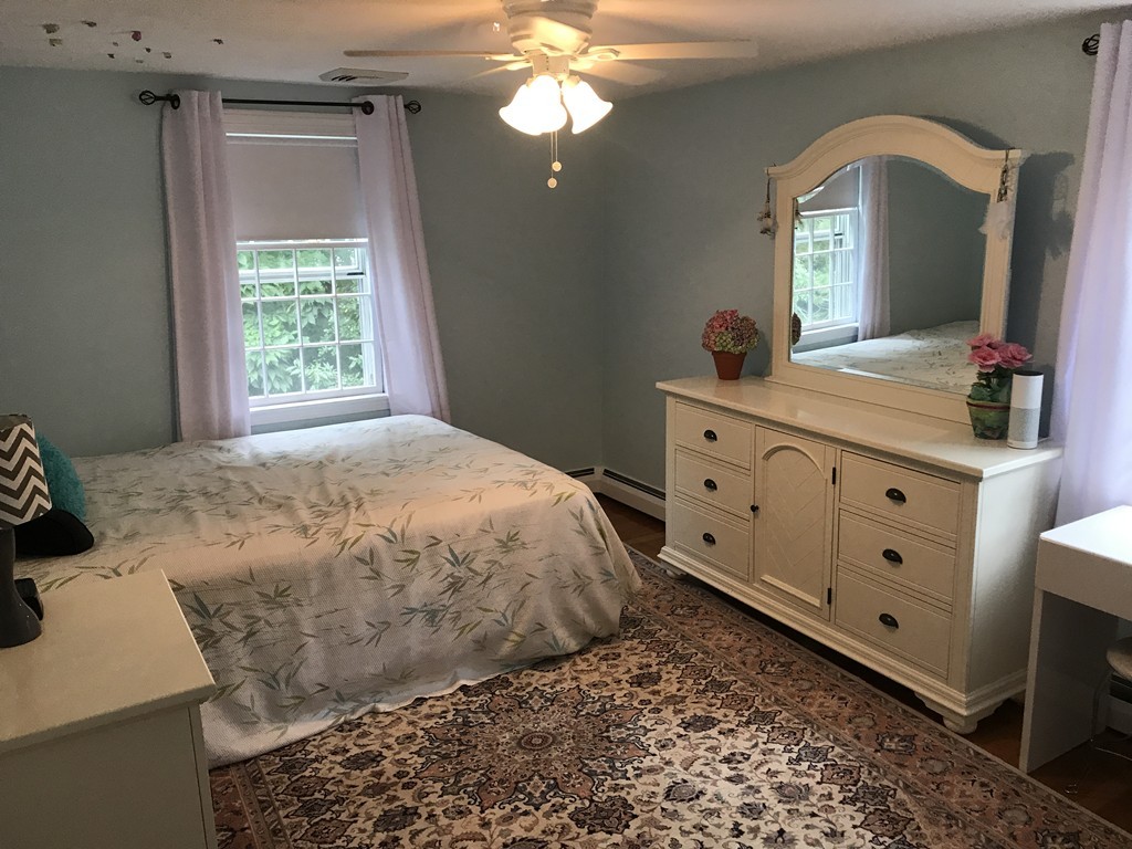 3 Carriage Way Topsfield, MA 01983 - Photo 16 of 30 a spacious bedroom with a bed and a dresser
