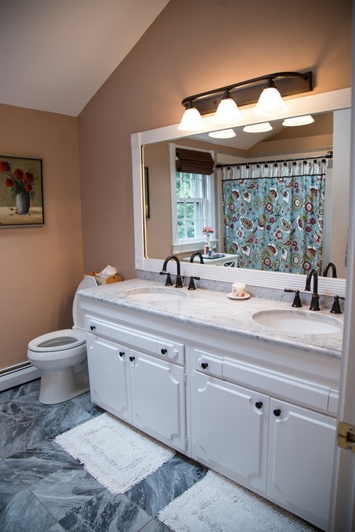 3 Carriage Way Topsfield, MA 01983 - Photo 19 of 30 a bathroom with a double vanity sink and a toilet