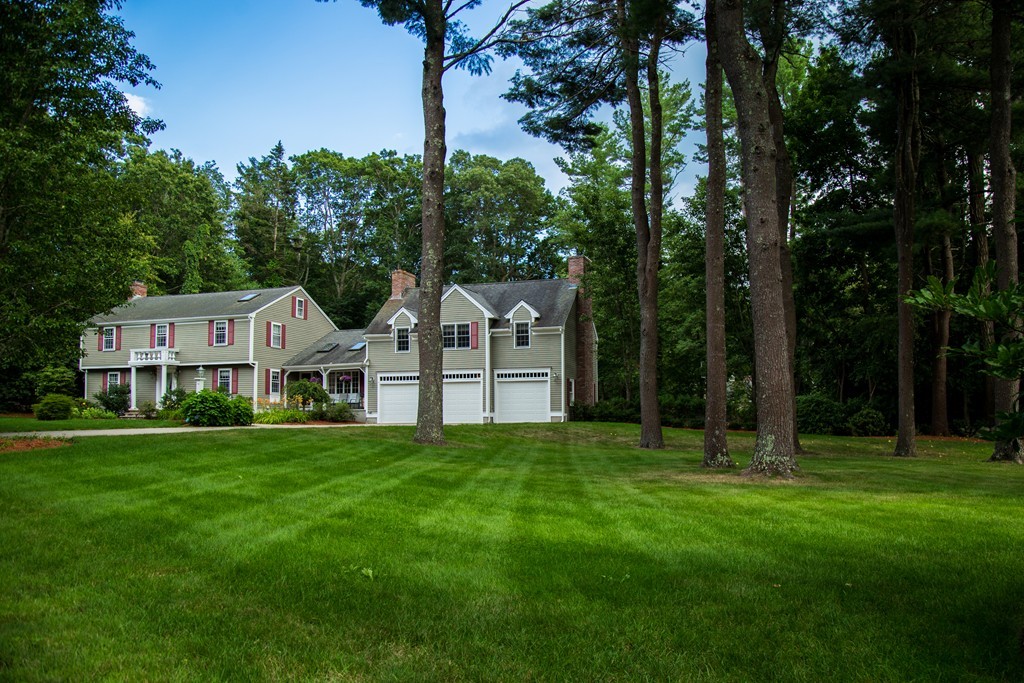 3 Carriage Way Topsfield, MA 01983 - Photo 2 of 30 a front view of a house with a yard and trees