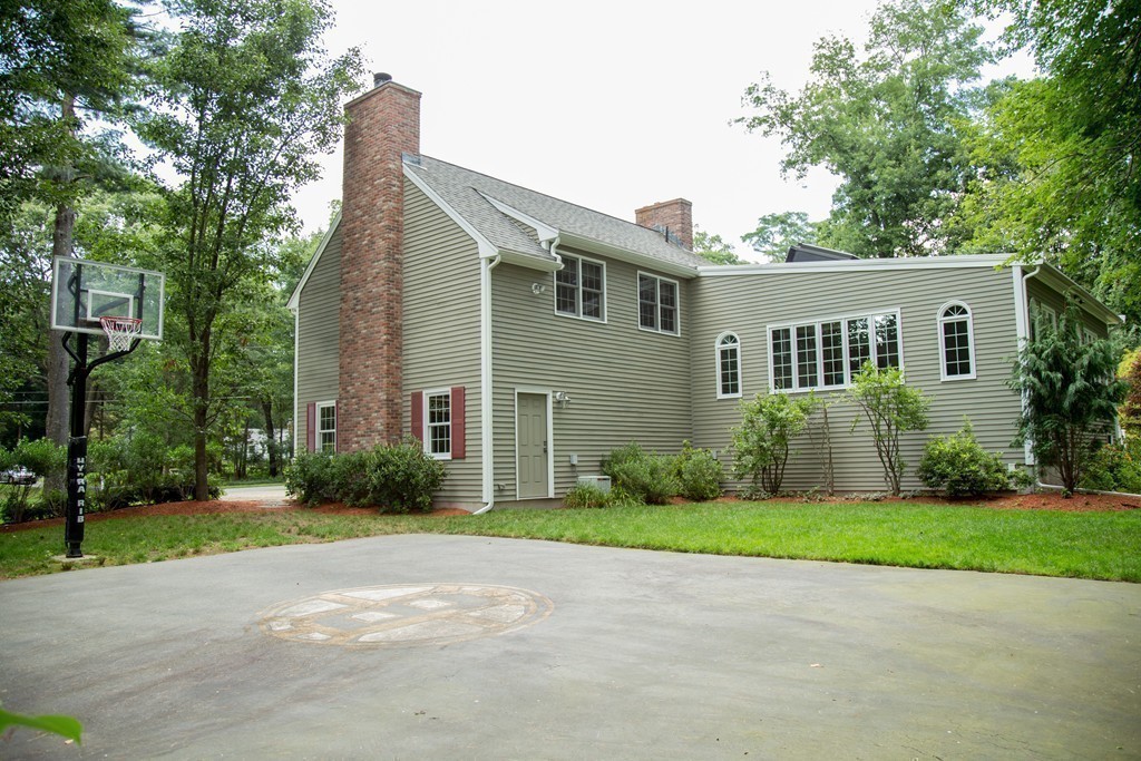 3 Carriage Way Topsfield, MA 01983 - Photo 27 of 30 a front view of house with yard and green space
