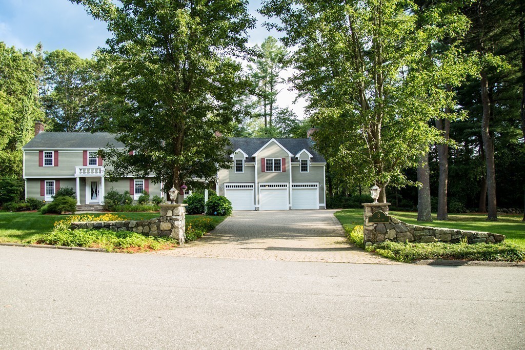 3 Carriage Way Topsfield, MA 01983 - Photo 28 of 30 a front view of a house with a yard and garage