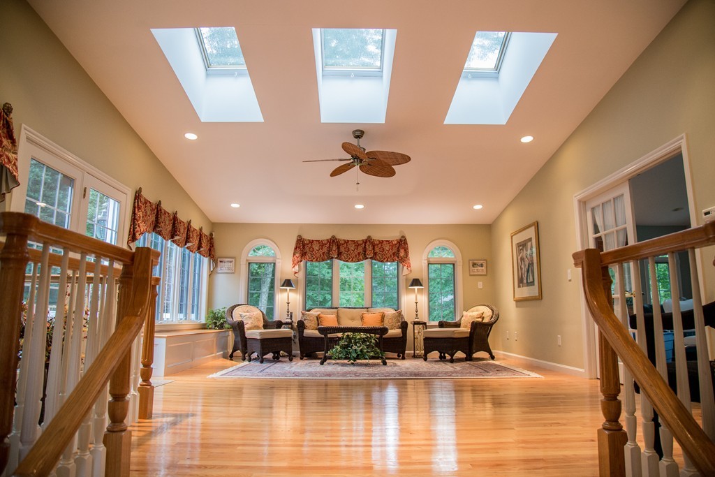 3 Carriage Way Topsfield, MA 01983 - Photo 5 of 30 a living room with fireplace furniture and a large window