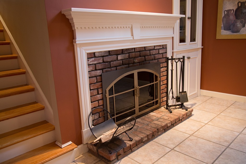 3 Carriage Way Topsfield, MA 01983 - Photo 6 of 30 a view of an entryway with wooden floor and staircase