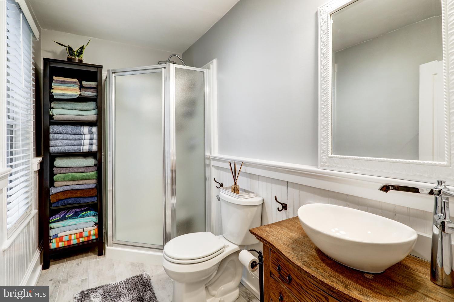 2448 Lititz Pike Lancaster, PA 17601 - Photo 20 of 43 a bathroom with a granite countertop toilet sink and mirror