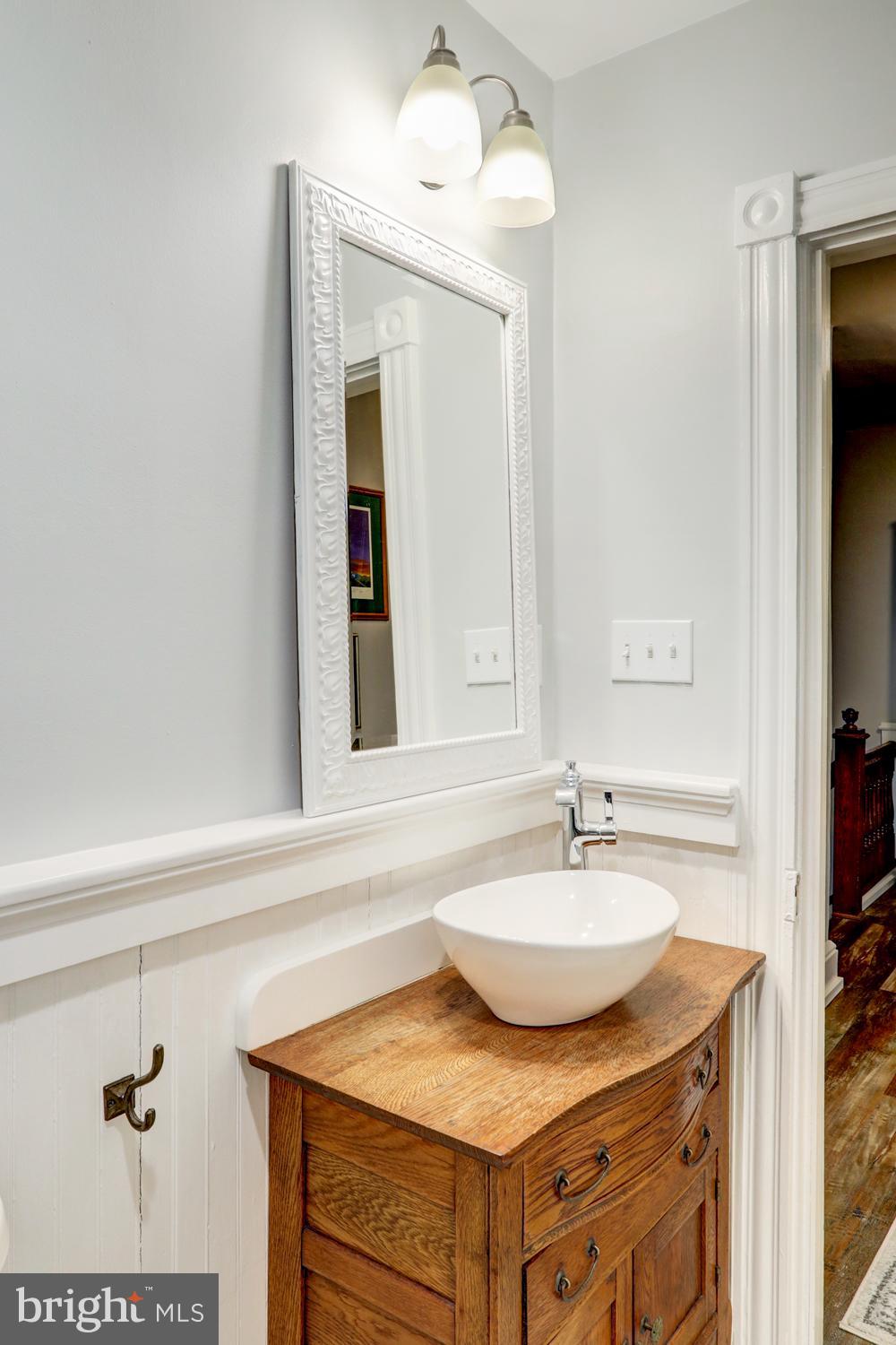 2448 Lititz Pike Lancaster, PA 17601 - Photo 21 of 43 a bathroom with a sink and a mirror