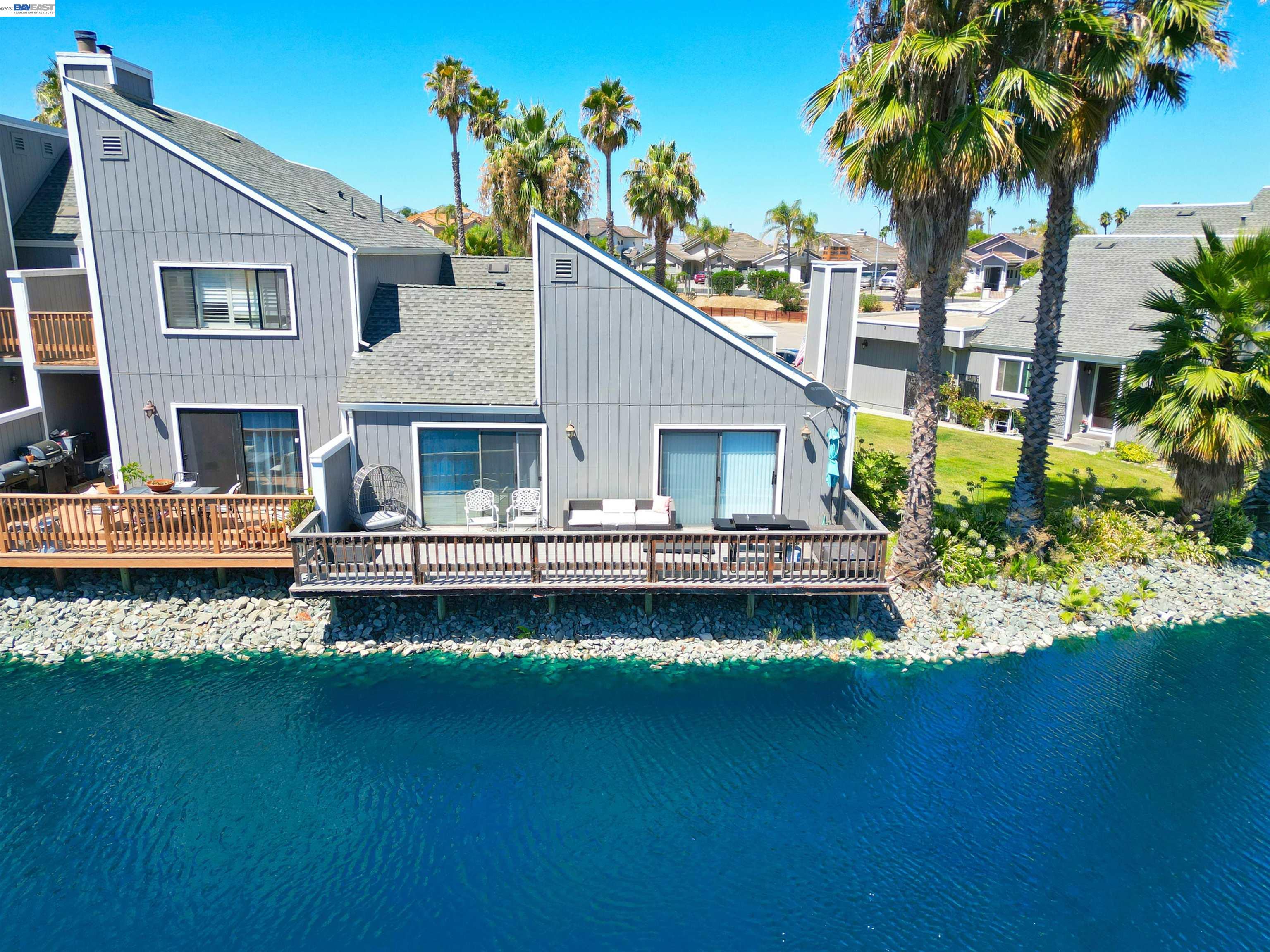 2073 Sand Point Road Discovery Bay, CA 94505 - Photo 21 of 40 a front view of a house with garden