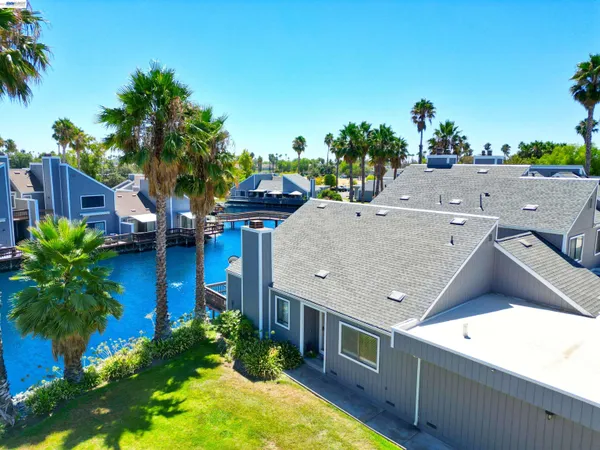 a aerial view of a house with a yard