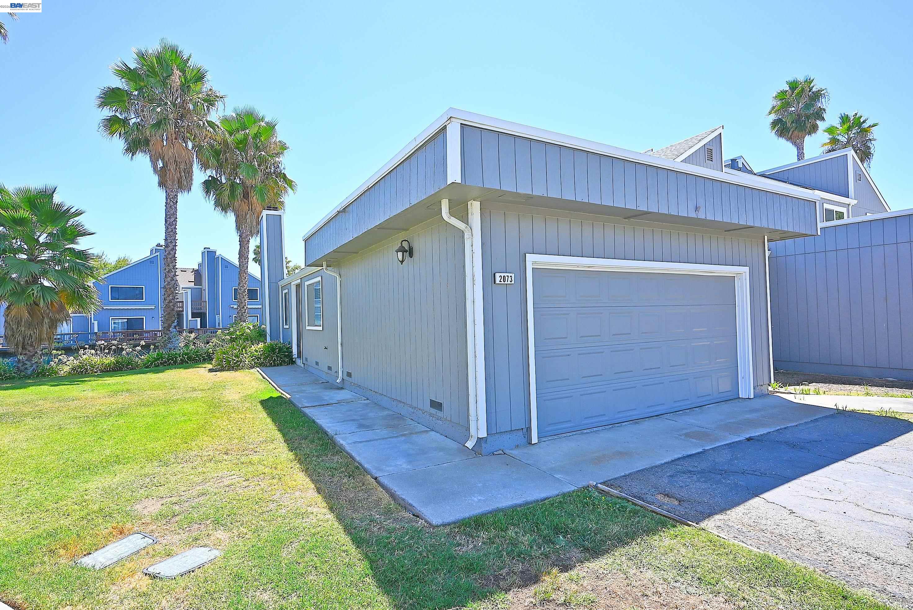 2073 Sand Point Road Discovery Bay, CA 94505 - Photo 9 of 40 a front view of house with yard