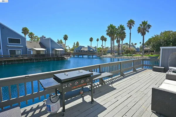 a view of a balcony with wooden floor and outdoor space