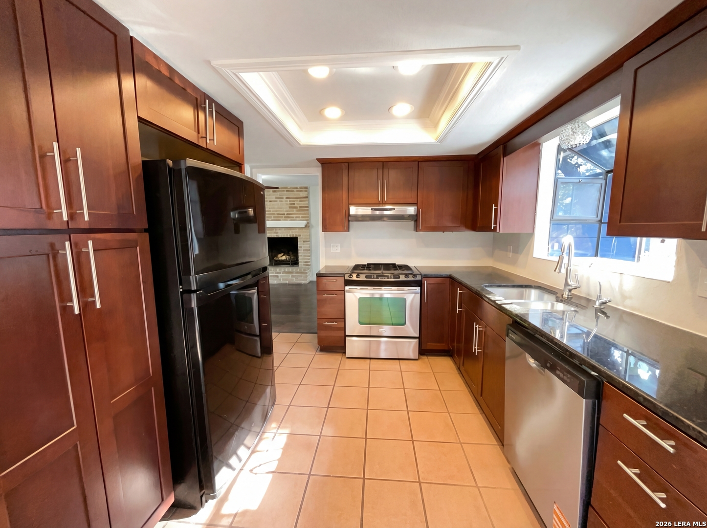 5423 Timberhurst San Antonio, TX 78250 - Photo 2 of 18 a kitchen with stainless steel appliances granite countertop a refrigerator a sink a stove a microwave and cabinets