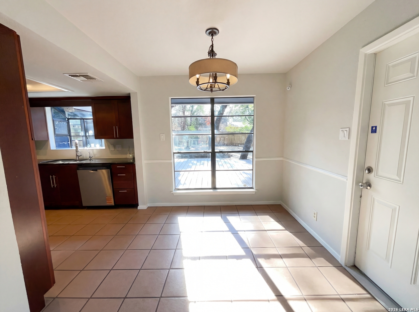 5423 Timberhurst San Antonio, TX 78250 - Photo 9 of 18 a kitchen with granite countertop a stove a sink and a granite counter top
