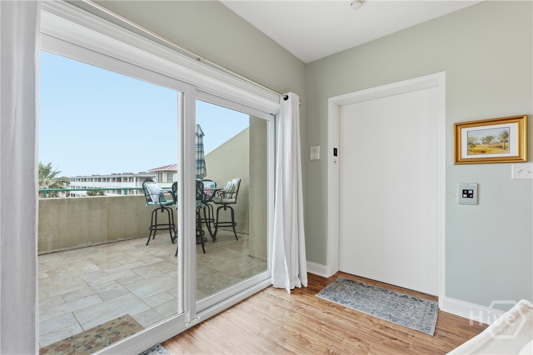 214 Butler Avenue, Unit 306 Tybee Island, GA 31328 - Photo 5 of 49 Large glass sliding door leads to Balcony with Atlantic Ocean views