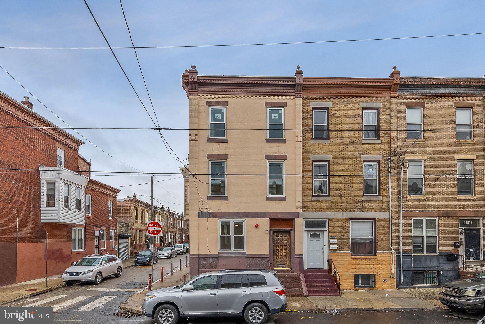 1812 South 17th Street, Unit 2 Philadelphia, PA 19145 - Photo 1 of 1 a couple of cars parked in front of a building