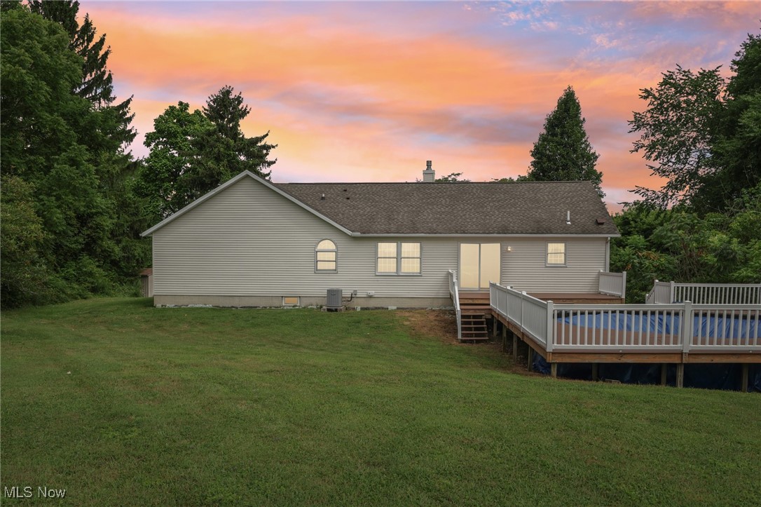 476 Garrison Road Ashtabula, OH 44004 - Photo 2 of 50 Back house at dusk featuring a deck and a yard