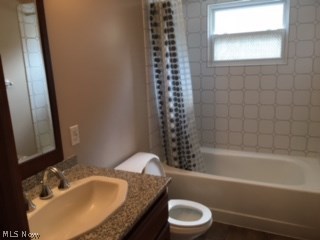 5953 Pearl Road Cleveland, OH 44130 - Photo 9 of 30 Full bath on main floor has granite counter top, new cabinets, and new sink.