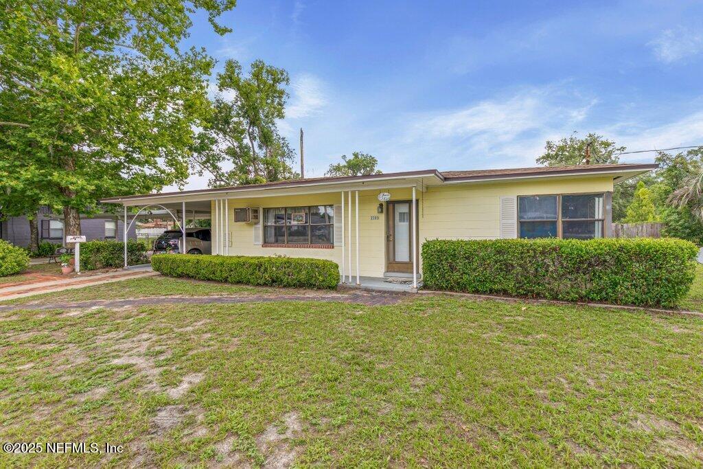 2305 Broward Road Jacksonville, FL 32218 - Photo 1 of 30 front view of a house with a yard