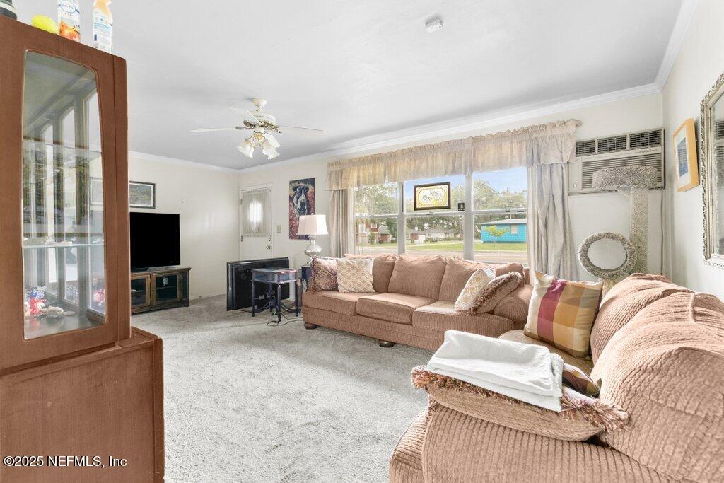 2305 Broward Road Jacksonville, FL 32218 - Photo 11 of 30 a living room with furniture and a flat screen tv
