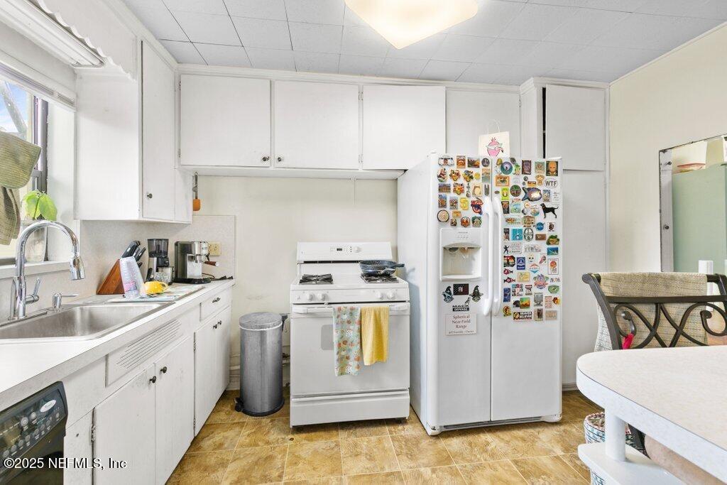 2305 Broward Road Jacksonville, FL 32218 - Photo 13 of 30 a kitchen with stainless steel appliances granite countertop a sink and cabinets