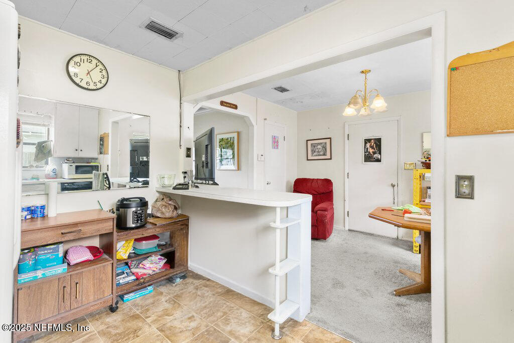 2305 Broward Road Jacksonville, FL 32218 - Photo 16 of 30 a view of a play room with furniture and toys