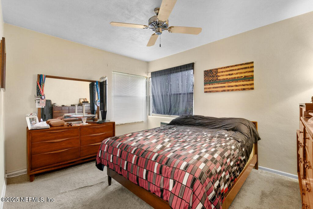 2305 Broward Road Jacksonville, FL 32218 - Photo 19 of 30 a bedroom with a bed and window