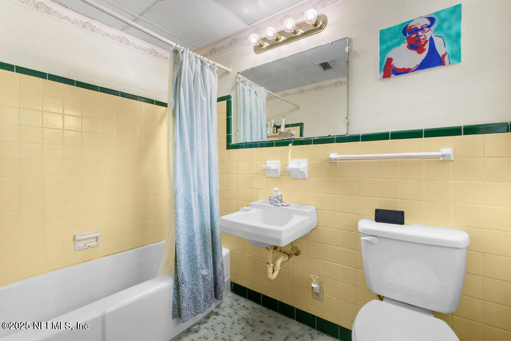 2305 Broward Road Jacksonville, FL 32218 - Photo 21 of 30 a bathroom with a sink toilet and shower