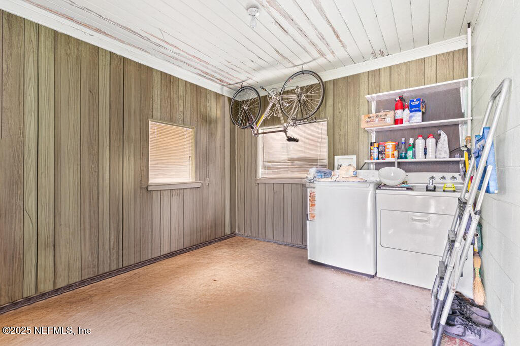 2305 Broward Road Jacksonville, FL 32218 - Photo 24 of 30 a storage room with cabinets washer and dryer