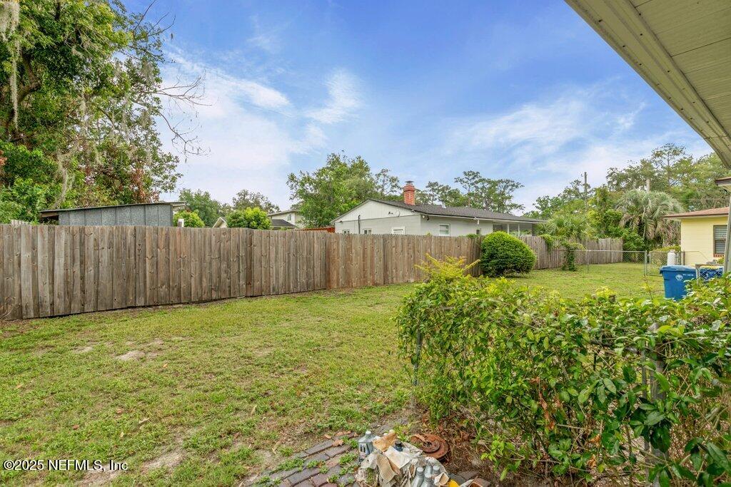 2305 Broward Road Jacksonville, FL 32218 - Photo 25 of 30 a view of garden with wooden fence
