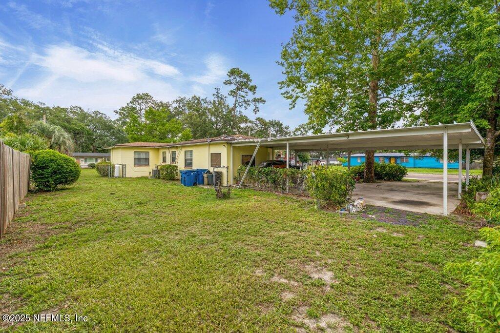 2305 Broward Road Jacksonville, FL 32218 - Photo 26 of 30 a view of a house with backyard and sitting area