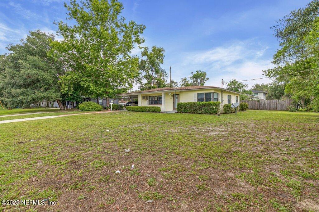 2305 Broward Road Jacksonville, FL 32218 - Photo 4 of 30 a view of house with yard outdoor seating and barbeque oven