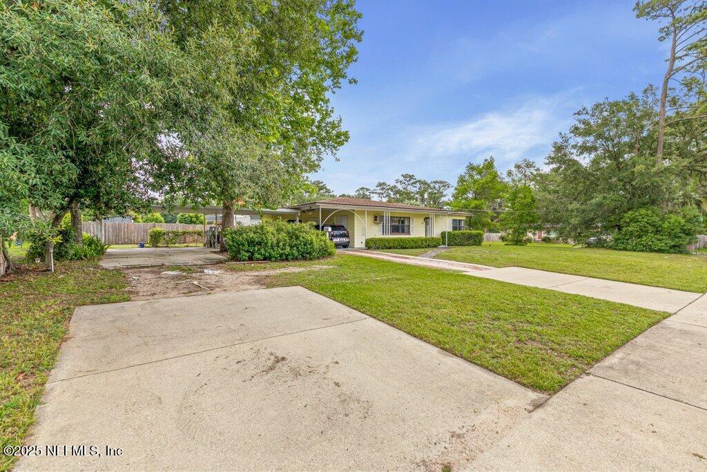 2305 Broward Road Jacksonville, FL 32218 - Photo 6 of 30 a view of yard with swimming pool and green space