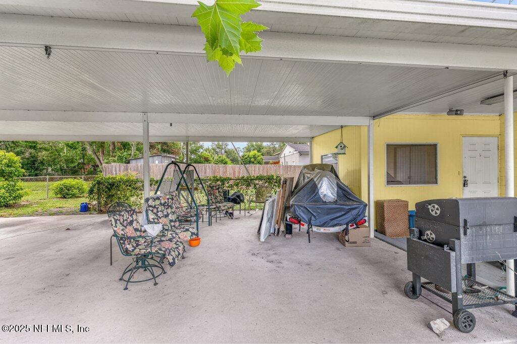 2305 Broward Road Jacksonville, FL 32218 - Photo 7 of 30 a view of a patio with a table and chairs