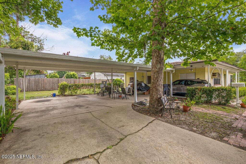 2305 Broward Road Jacksonville, FL 32218 - Photo 8 of 30 a row of palm trees in front of a house