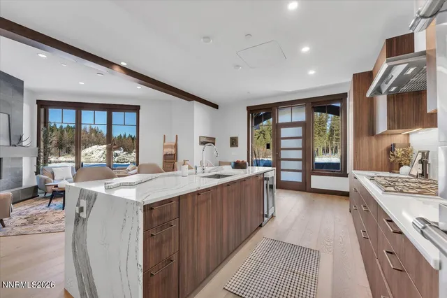 a spacious bedroom with a large bed and a large window