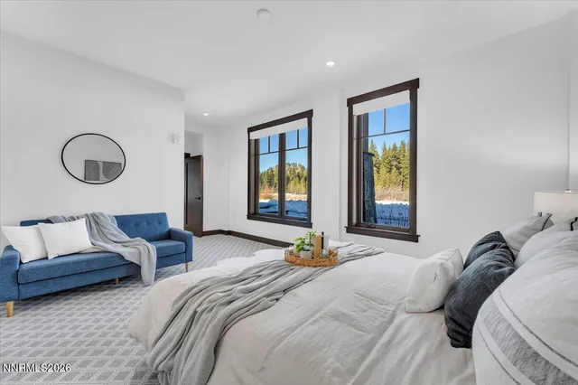 a view of a patio with table and chairs with wooden floor and fence