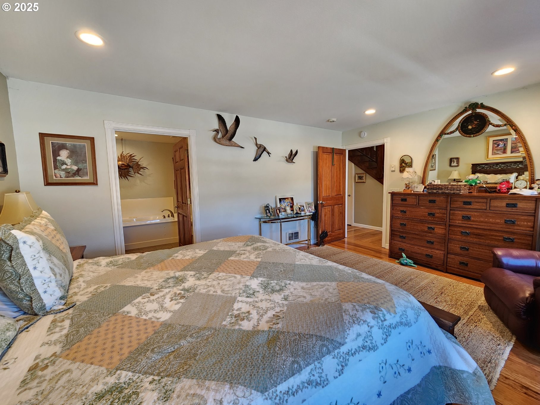 1126 Washington Street Port Orford, OR 97465 - Photo 12 of 32 a bedroom with a bed and a dresser