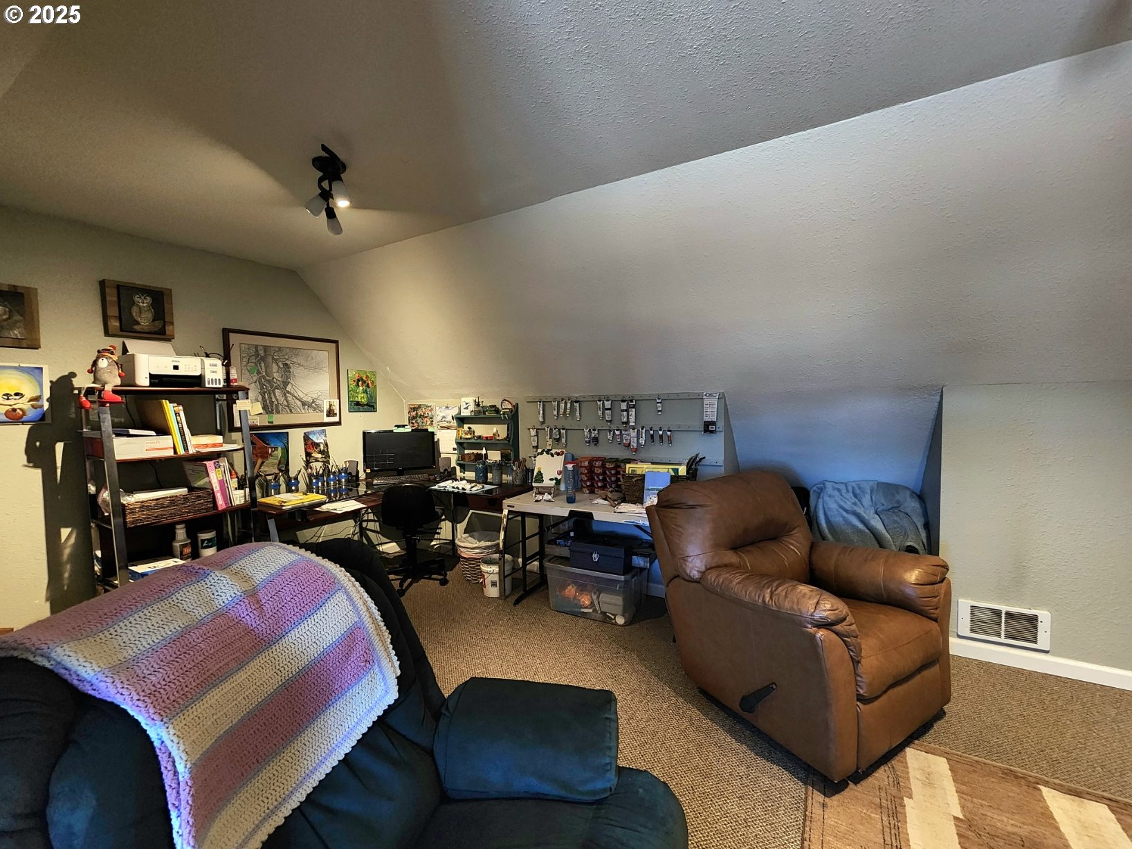 1126 Washington Street Port Orford, OR 97465 - Photo 23 of 32 a living room with furniture a flat screen tv and couches