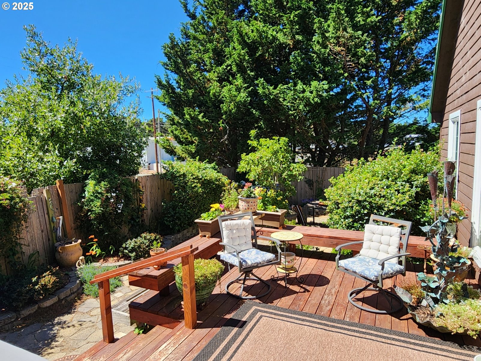 1126 Washington Street Port Orford, OR 97465 - Photo 28 of 32 a view of backyard of house with seating space