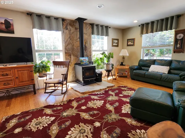 a living room with furniture fireplace and window