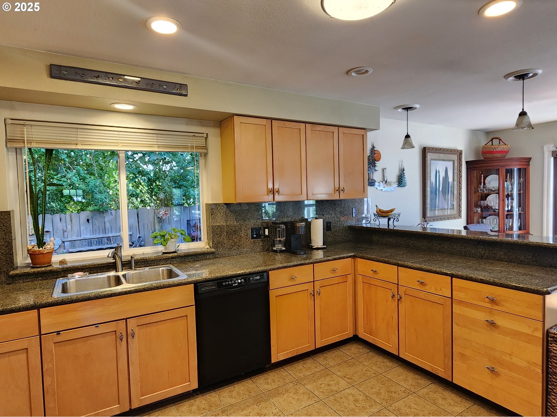 1126 Washington Street Port Orford, OR 97465 - Photo 7 of 32 a kitchen with stainless steel appliances granite countertop white cabinets sink and large window