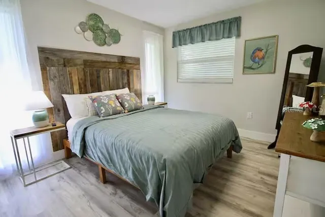 a view of a room with stairs and wooden floor
