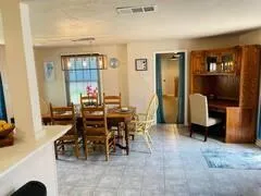 a view of a livingroom with furniture and window